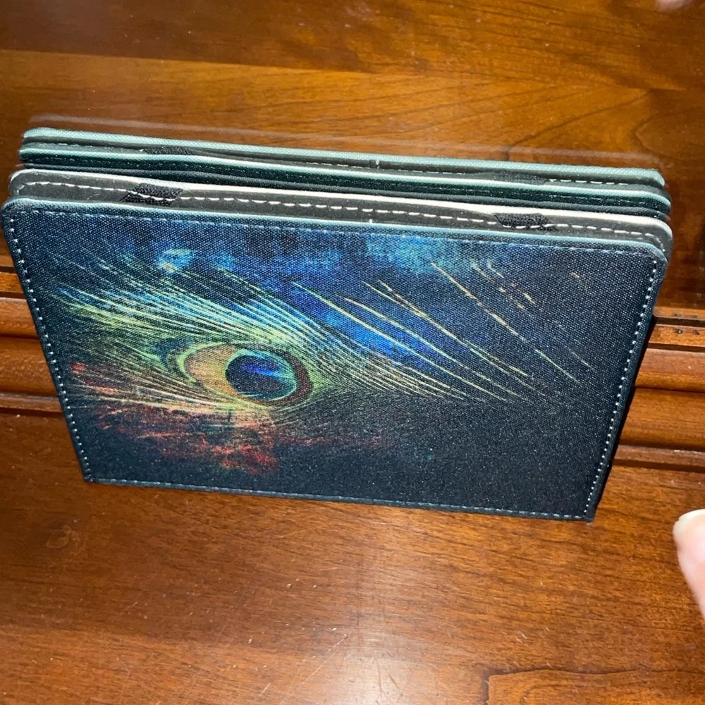Caseable Tablet case cover 7” with peacock feather motif. Excellent pre used